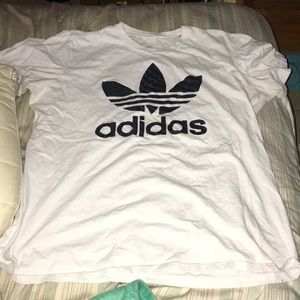 white adidas shirt.